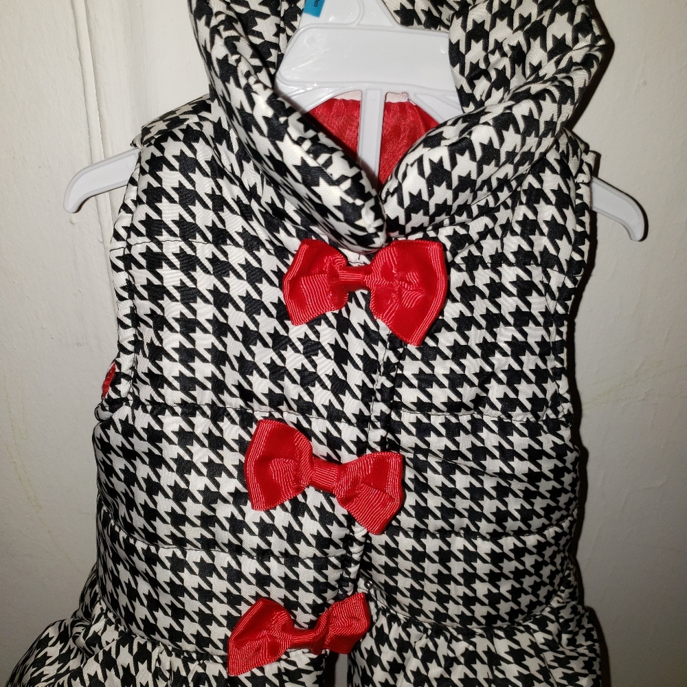 Black white and red vest